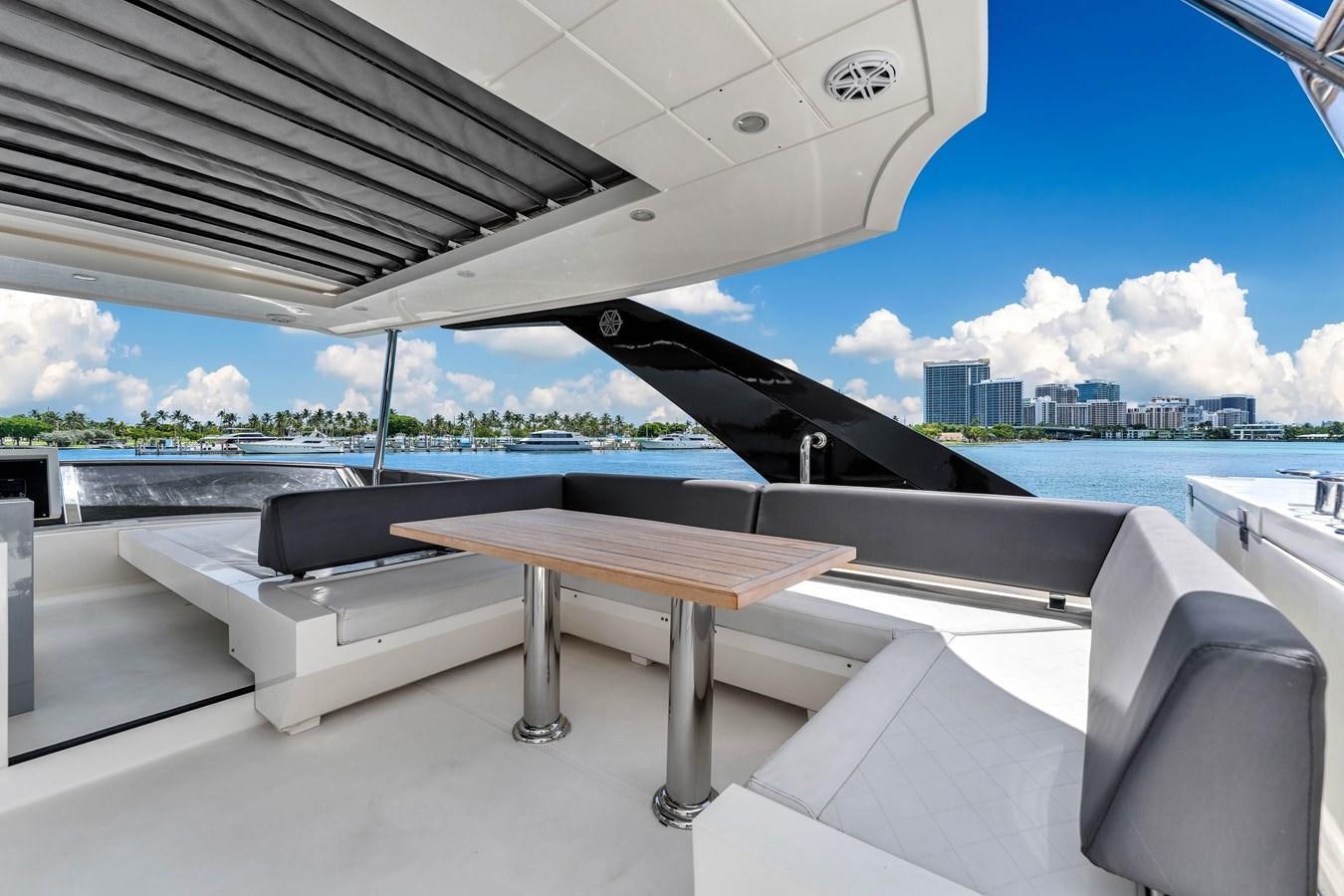 a table and chairs on a boat aboard GREYT ESCAPE Yacht for Sale