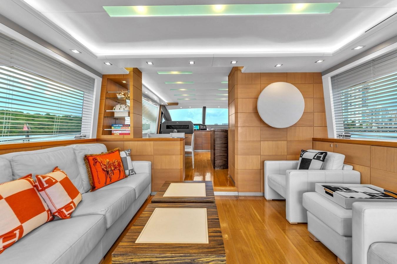 a living room with a couch and a table aboard GREYT ESCAPE Yacht for Sale