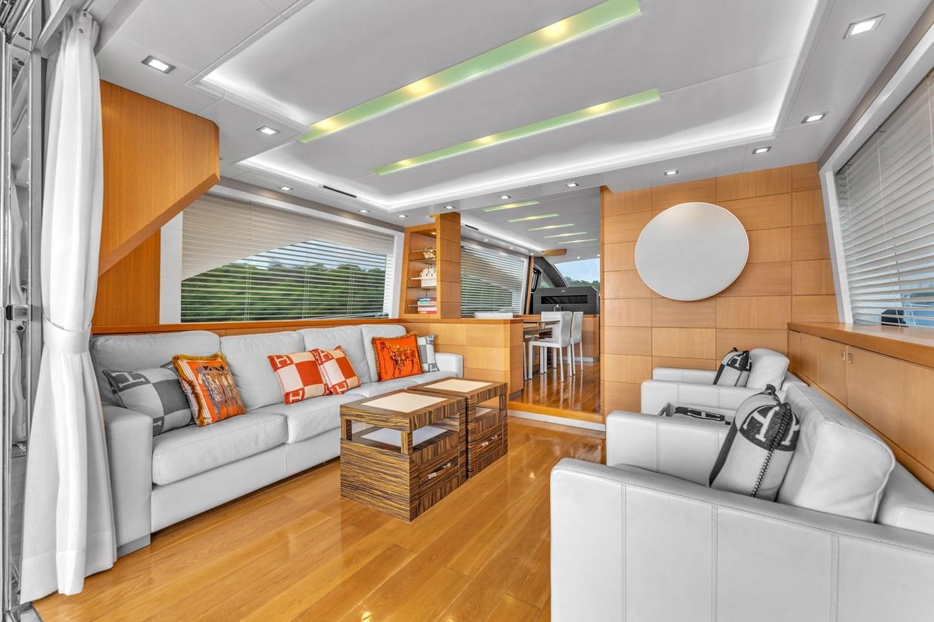 a living room with a couch and a table aboard GREYT ESCAPE Yacht for Sale