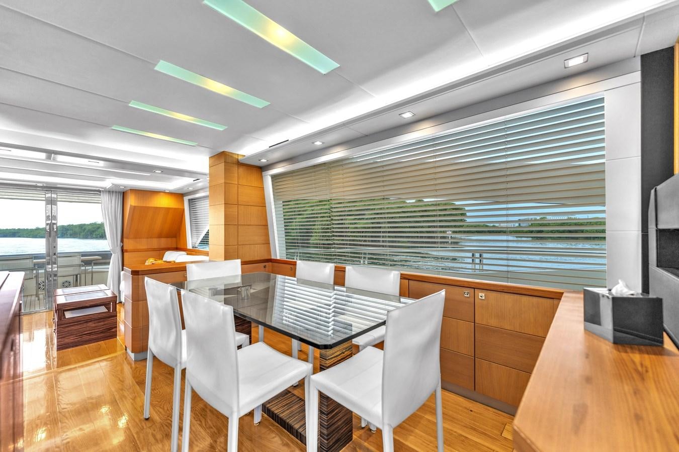 a room with a table and chairs aboard GREYT ESCAPE Yacht for Sale