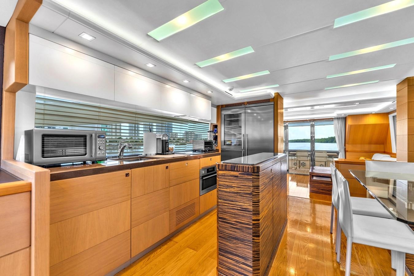 a kitchen with wooden cabinets aboard GREYT ESCAPE Yacht for Sale