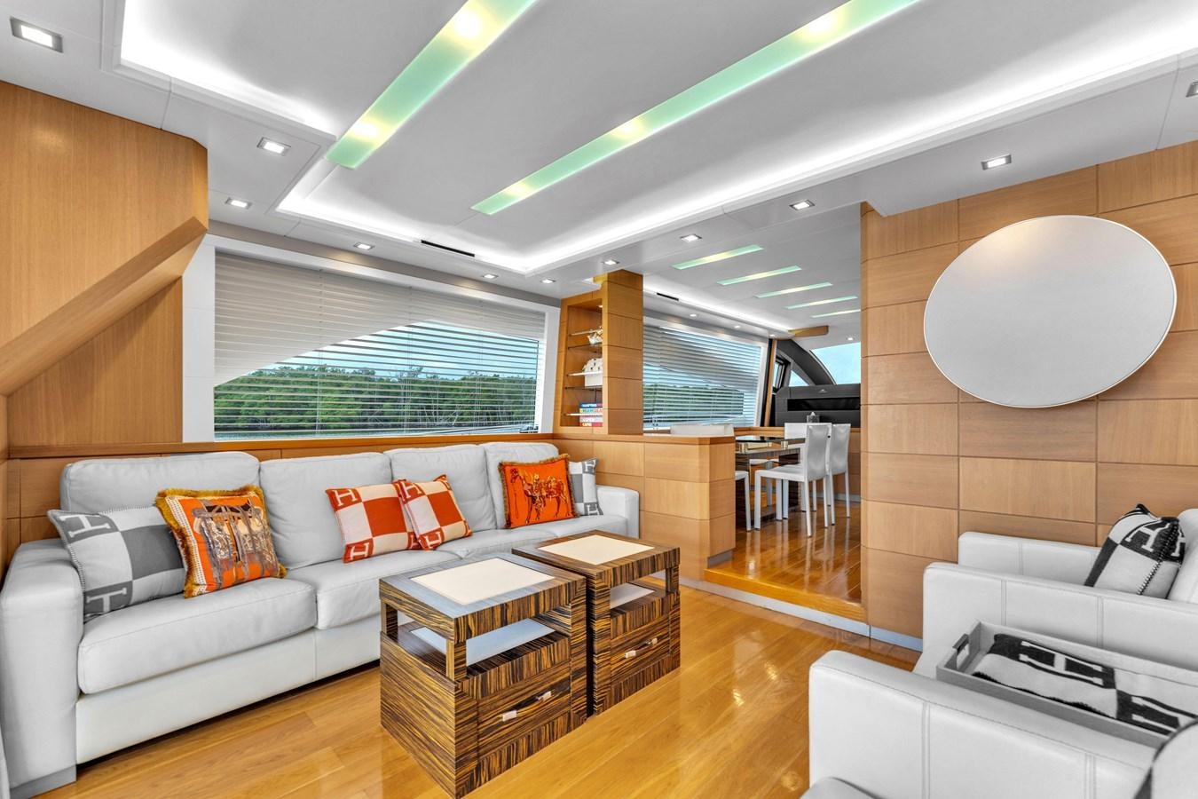 a living room with a couch and a table aboard GREYT ESCAPE Yacht for Sale