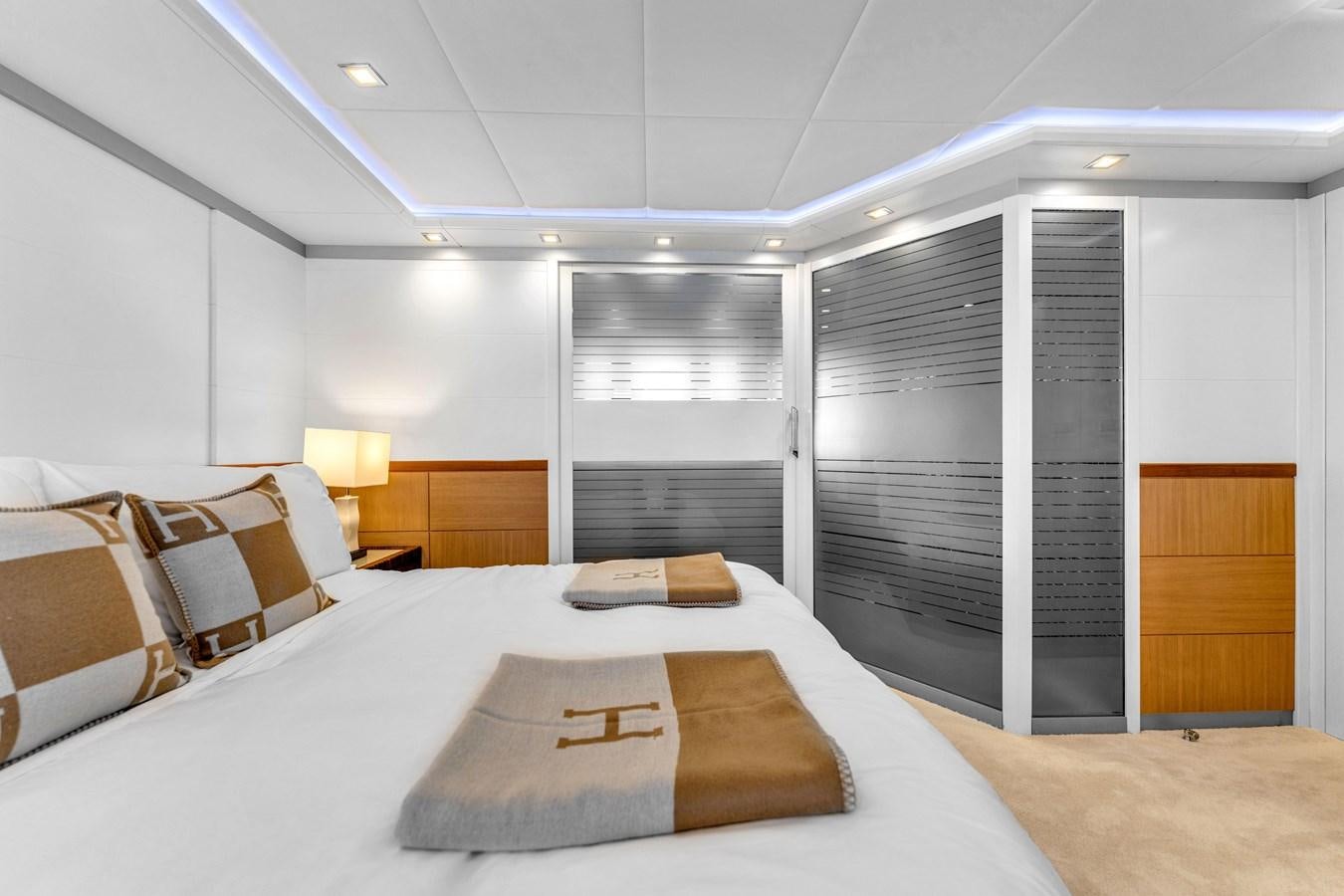 a large bedroom with a bed aboard GREYT ESCAPE Yacht for Sale
