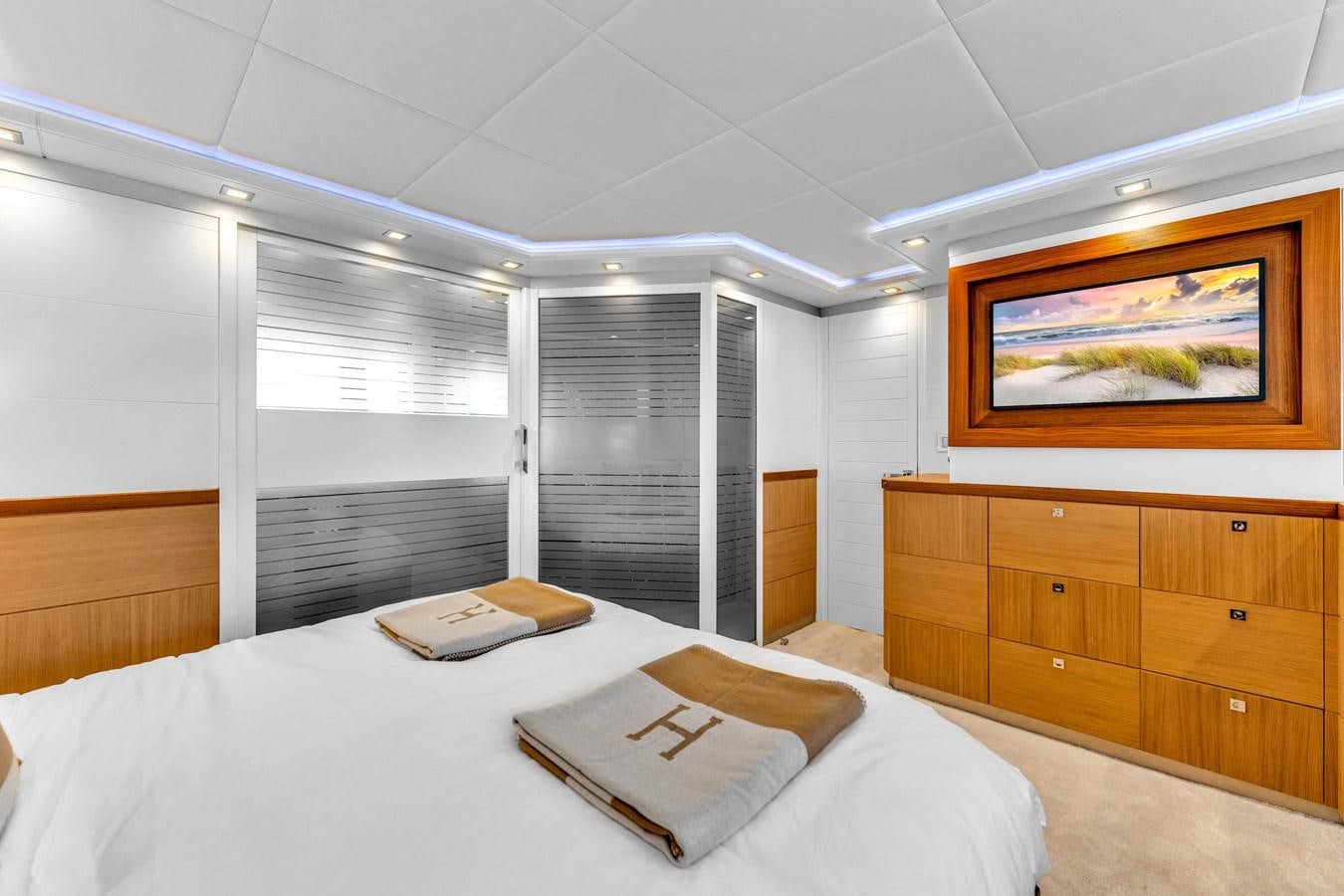 a room with a bed and a desk aboard GREYT ESCAPE Yacht for Sale