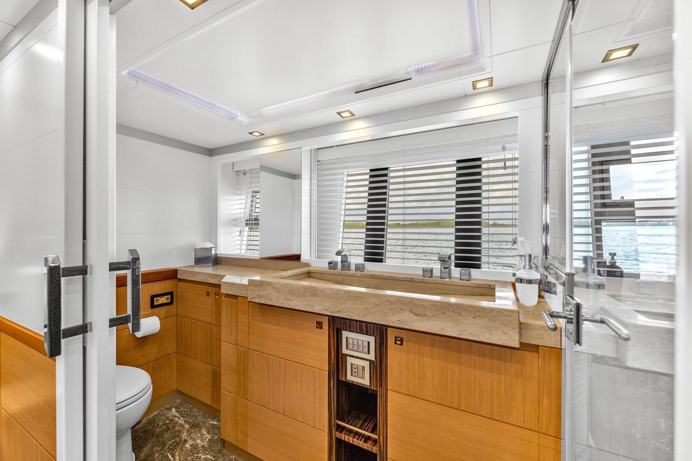 a bathroom with a sink and a toilet aboard GREYT ESCAPE Yacht for Sale