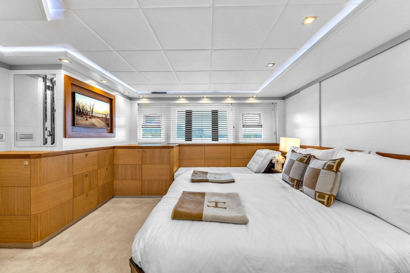 a room with a bed and a television aboard GREYT ESCAPE Yacht for Sale