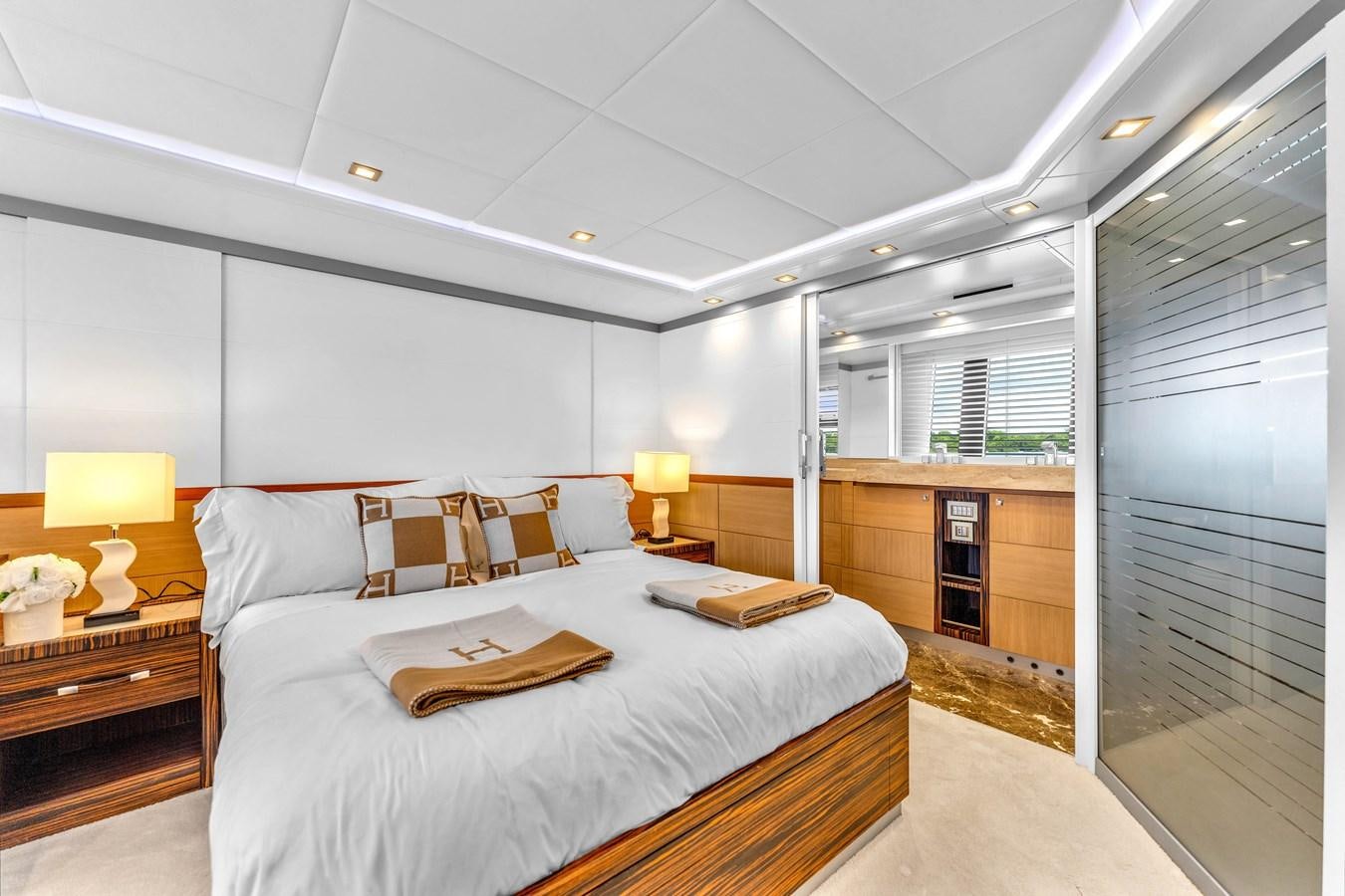 a large bedroom with a bed aboard GREYT ESCAPE Yacht for Sale