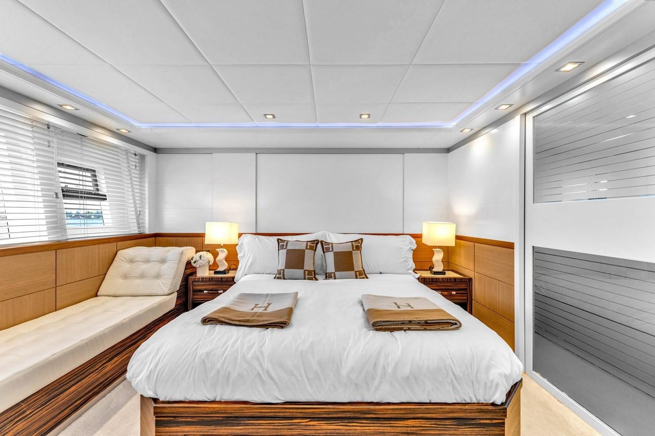 a bedroom with two beds aboard GREYT ESCAPE Yacht for Sale