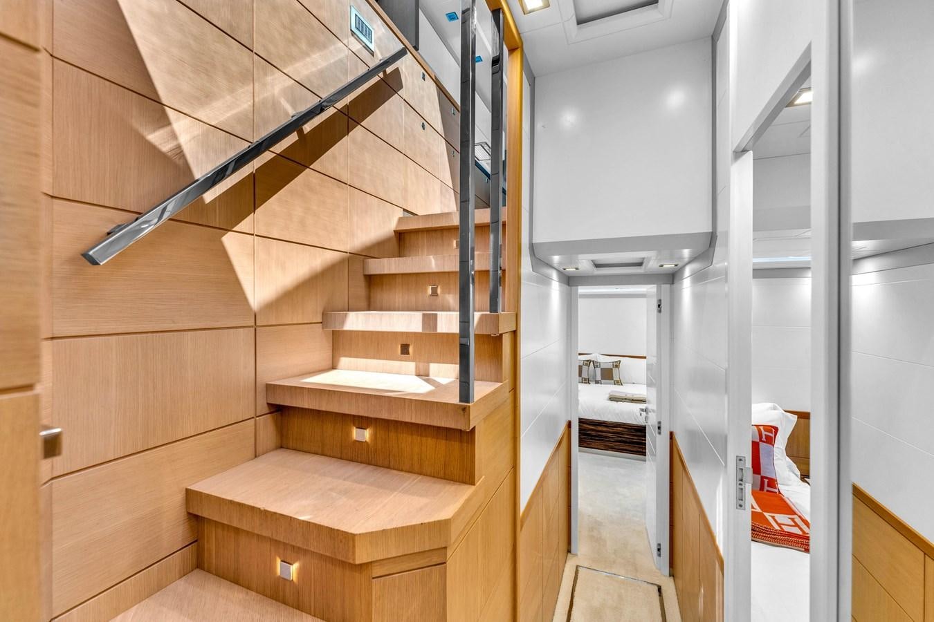 a wooden staircase in a room aboard GREYT ESCAPE Yacht for Sale