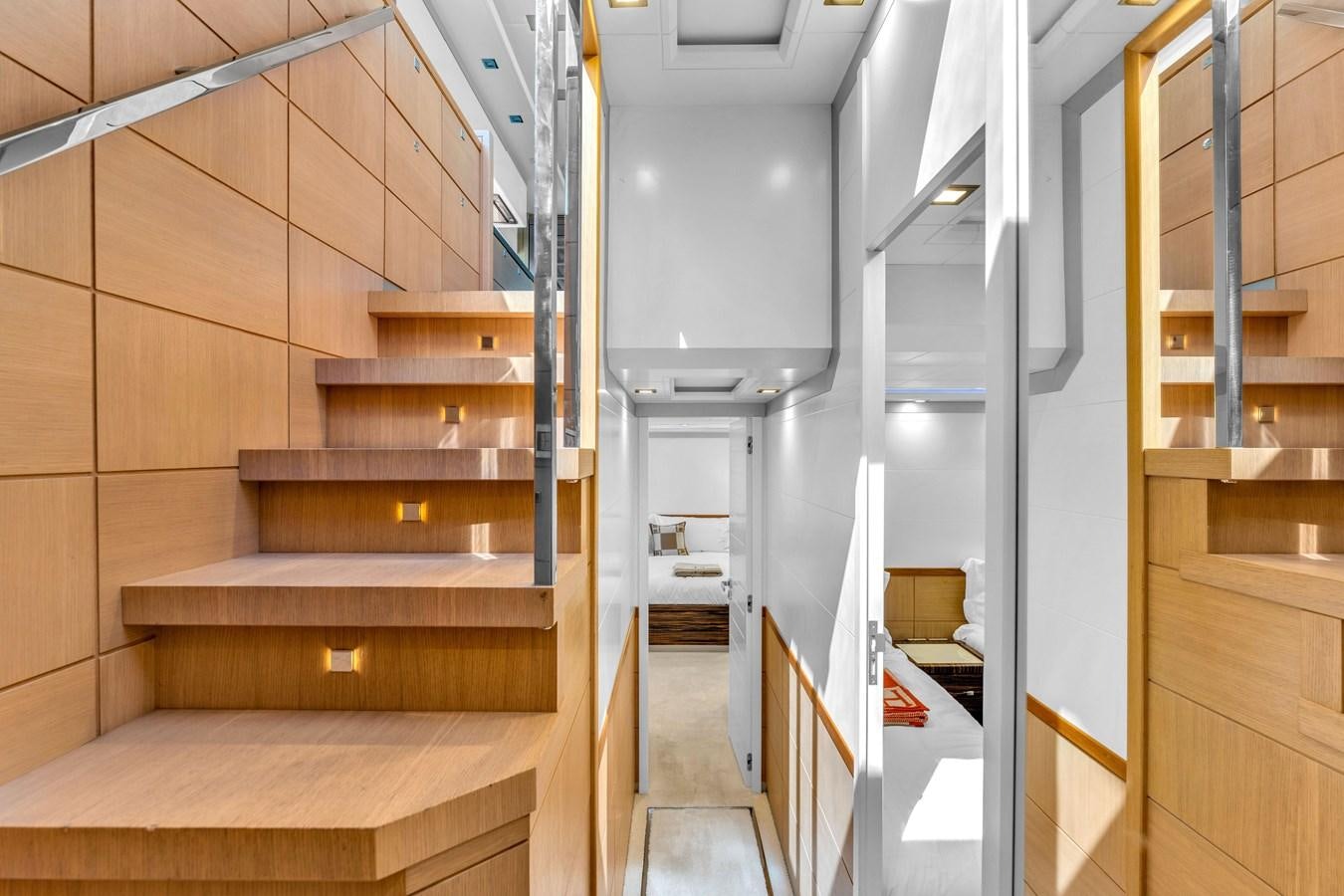 a room with wooden stairs aboard GREYT ESCAPE Yacht for Sale