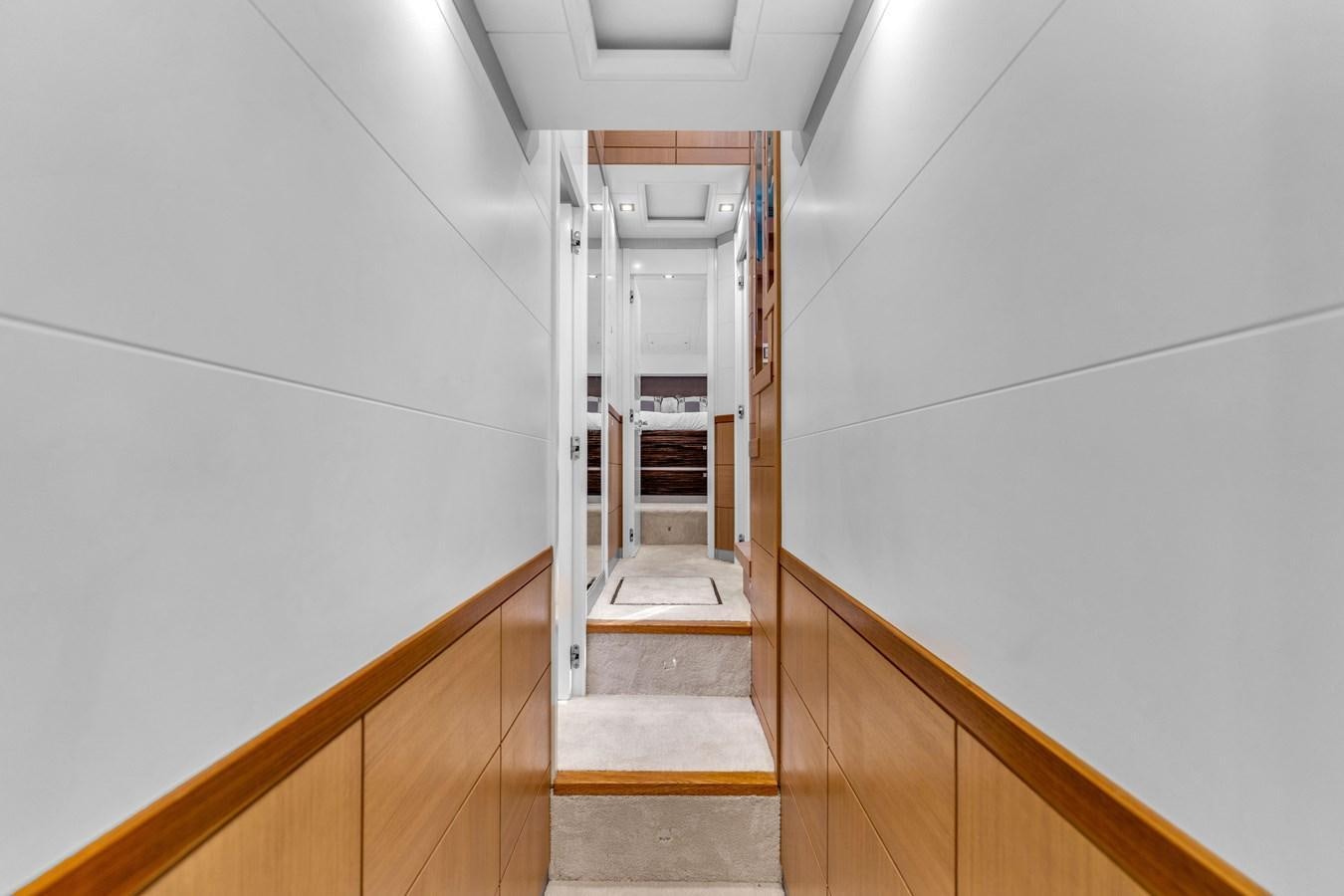 a hallway with white walls aboard GREYT ESCAPE Yacht for Sale