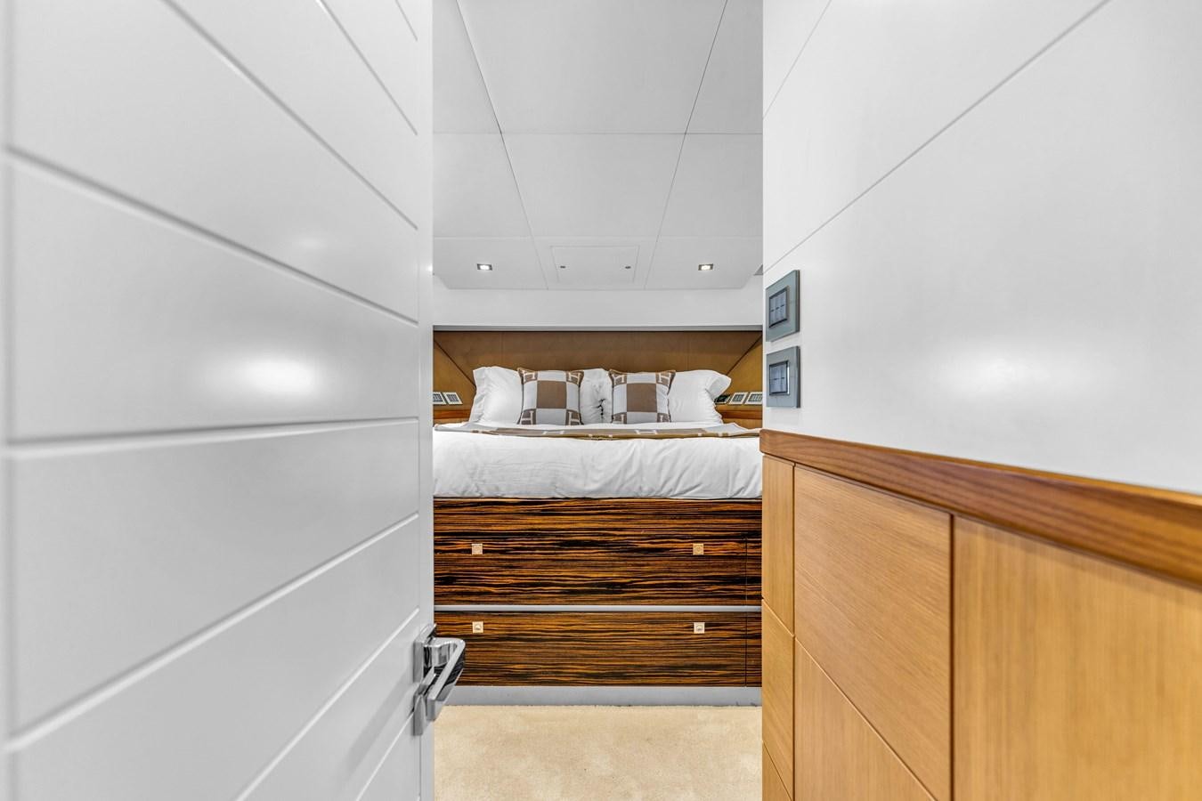 a bedroom with a bed aboard GREYT ESCAPE Yacht for Sale