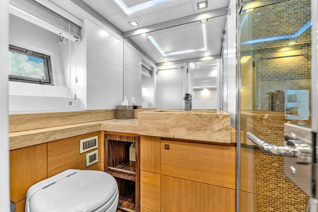 a bathroom with a glass shower aboard GREYT ESCAPE Yacht for Sale