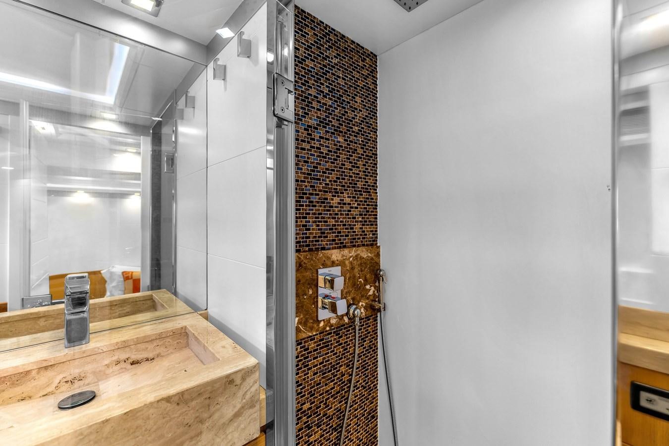 a room with a wood shelf and a wood counter with a wood cabinet aboard GREYT ESCAPE Yacht for Sale