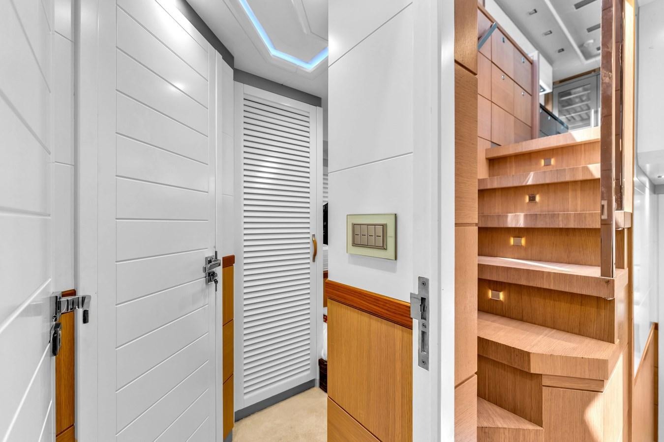 a room with wooden cabinets aboard GREYT ESCAPE Yacht for Sale