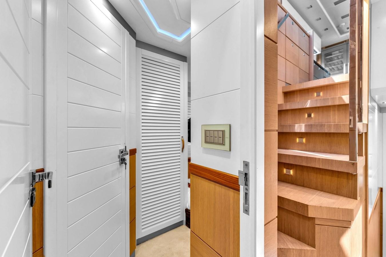 a room with wooden cabinets aboard GREYT ESCAPE Yacht for Sale