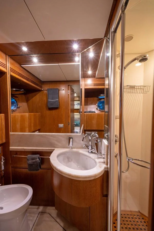 a bathroom with a sink and a shower aboard LOSAND Yacht for Sale