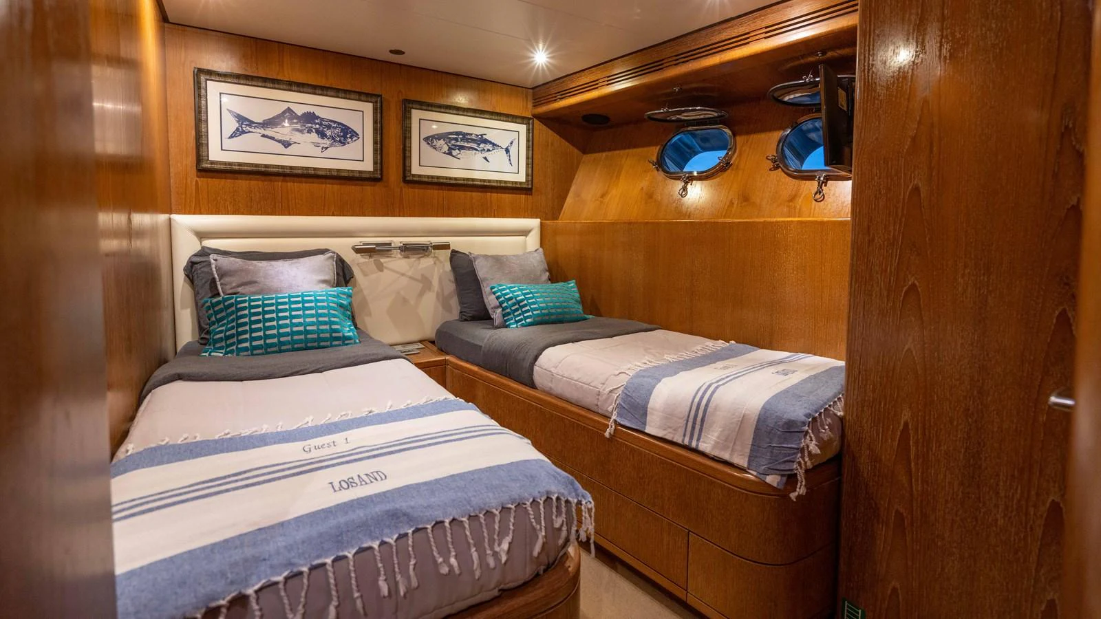 a couple of beds in a room aboard LOSAND Yacht for Sale