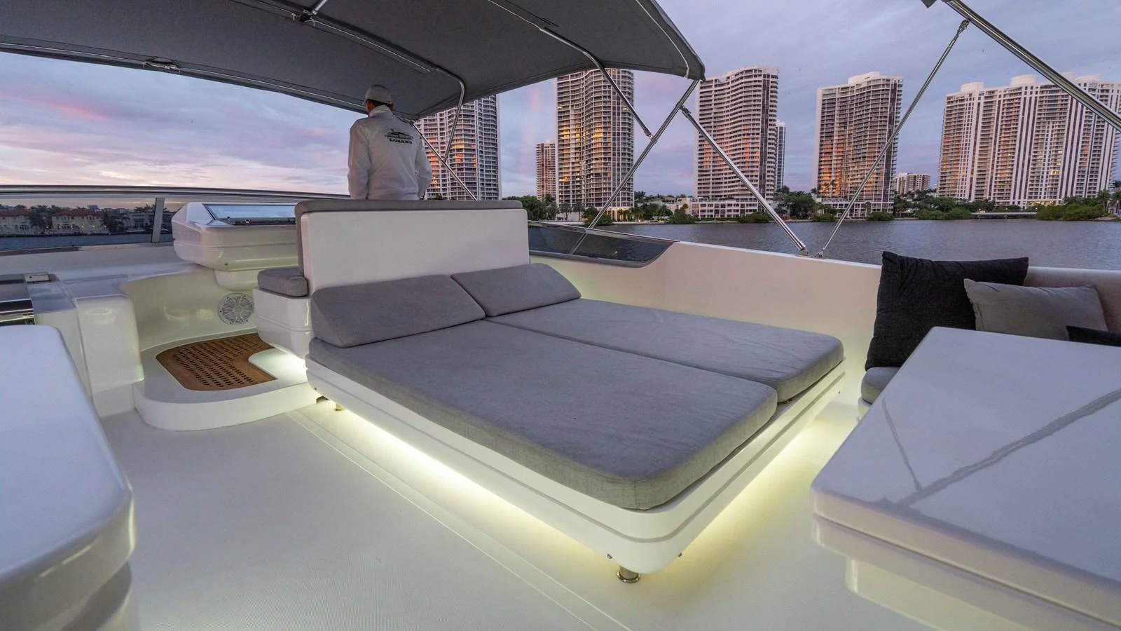 a large white table with a person standing in the background aboard LOSAND Yacht for Sale