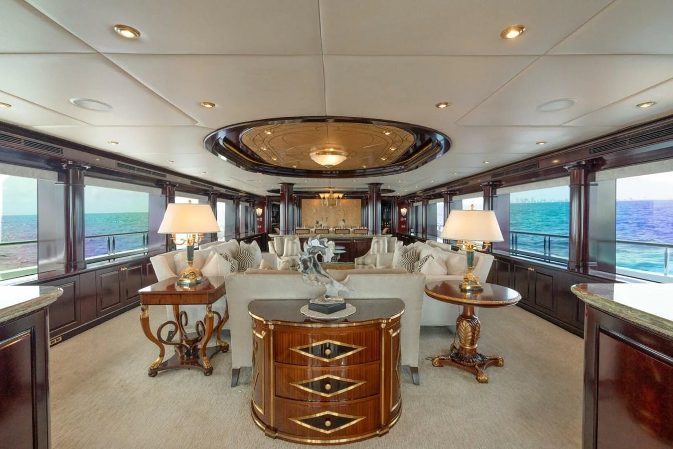 a large living room with a chandelier aboard MISS CHRISTINE Yacht for Sale