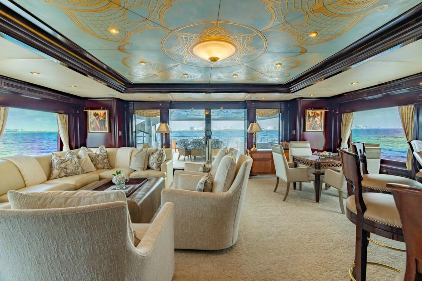 a living room with a large window aboard MISS CHRISTINE Yacht for Sale