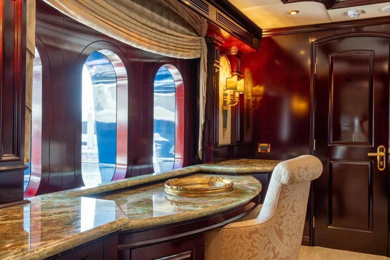 a room with a table and chairs aboard MISS CHRISTINE Yacht for Sale