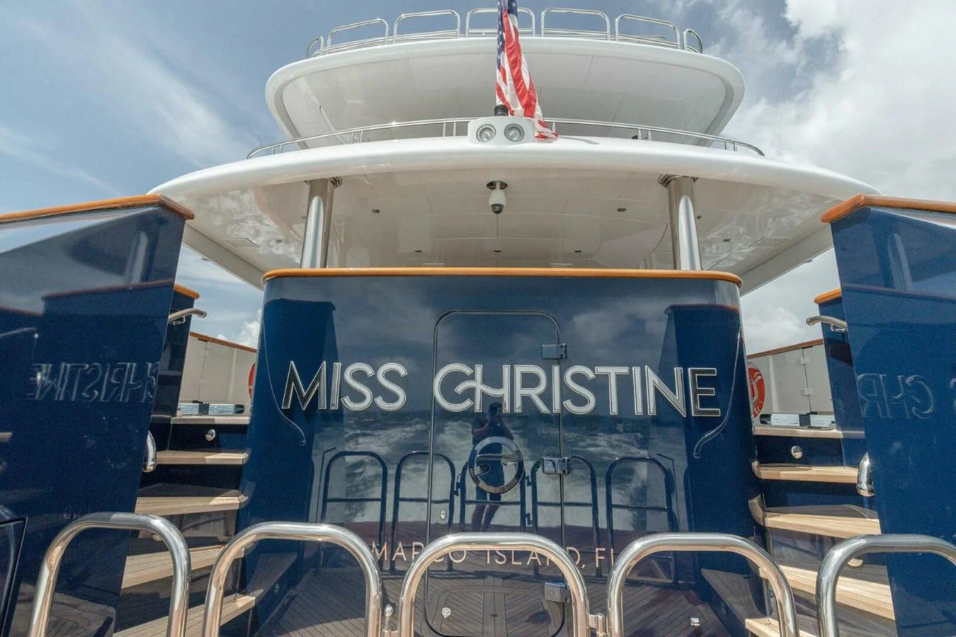 a boat with a flag on the front aboard MISS CHRISTINE Yacht for Sale
