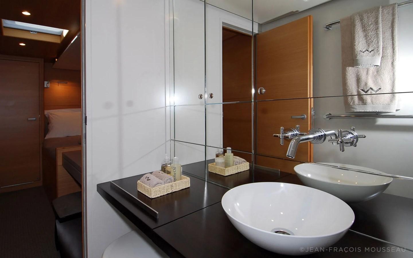 a bathroom with a sink and a mirror aboard WHIMSY Yacht for Sale