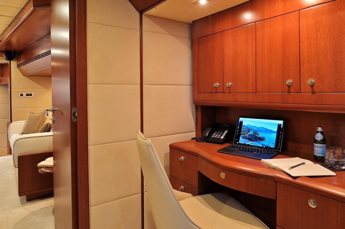 a laptop on a desk aboard CLARITY Yacht for Sale