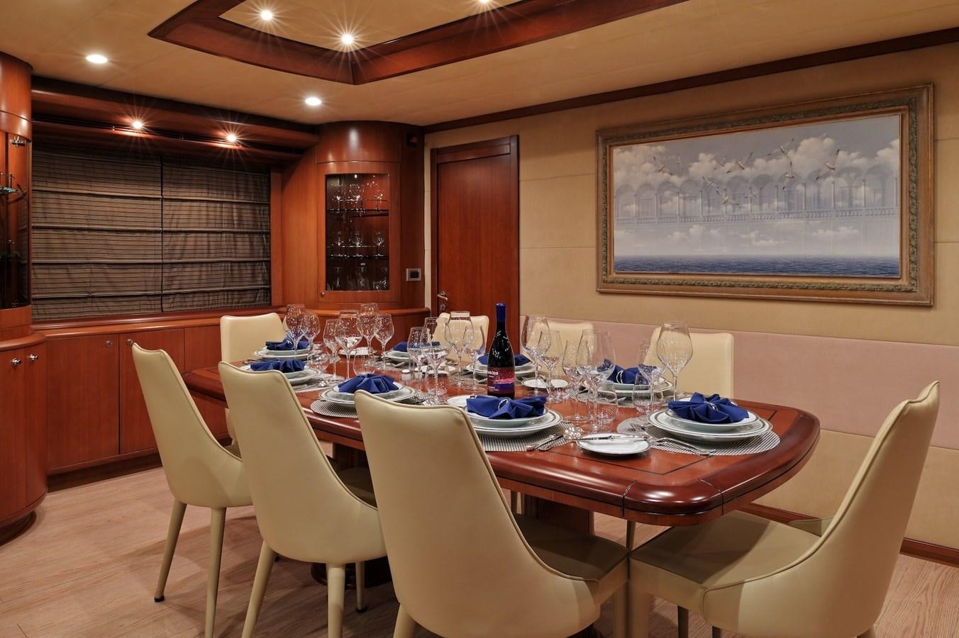 a table set for a dinner aboard CLARITY Yacht for Sale