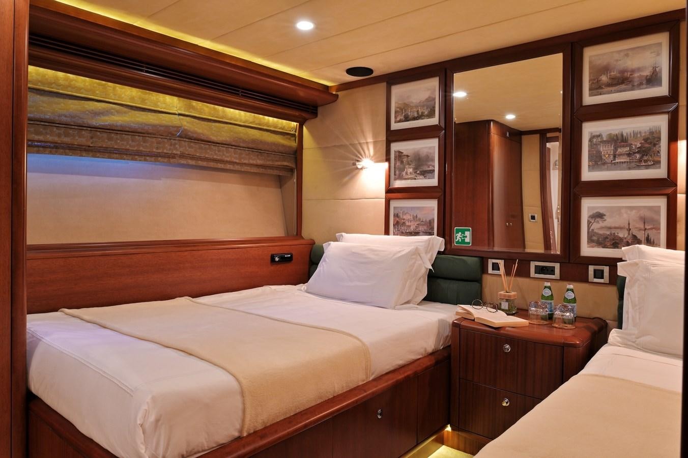 a room with a bed and a mirror aboard CLARITY Yacht for Sale