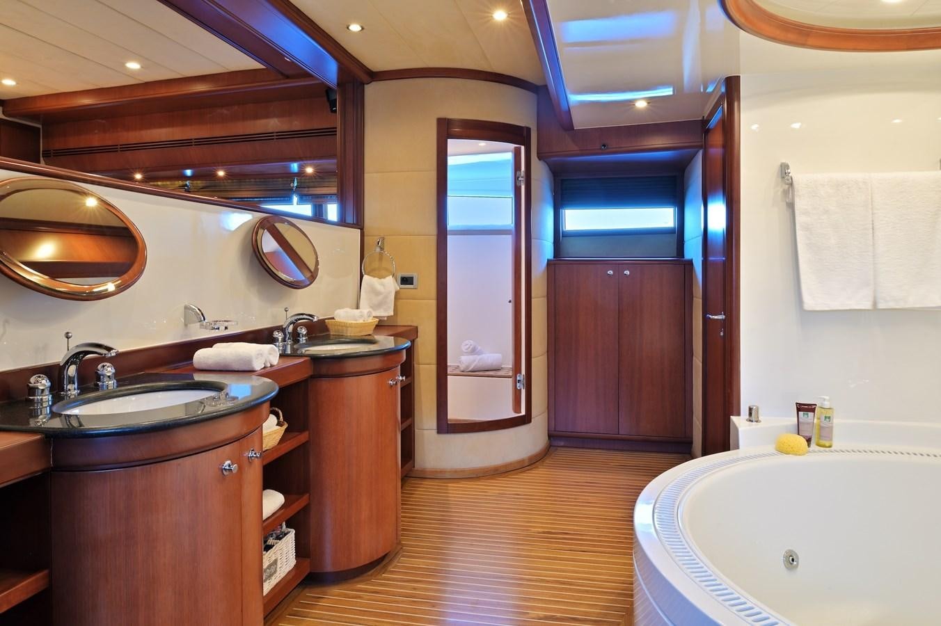 a bathroom with a sink and a bathtub aboard CLARITY Yacht for Sale