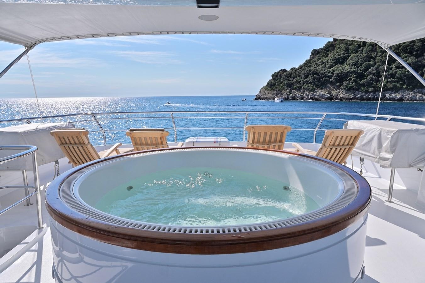 a pool on a deck overlooking the ocean aboard CLARITY Yacht for Sale