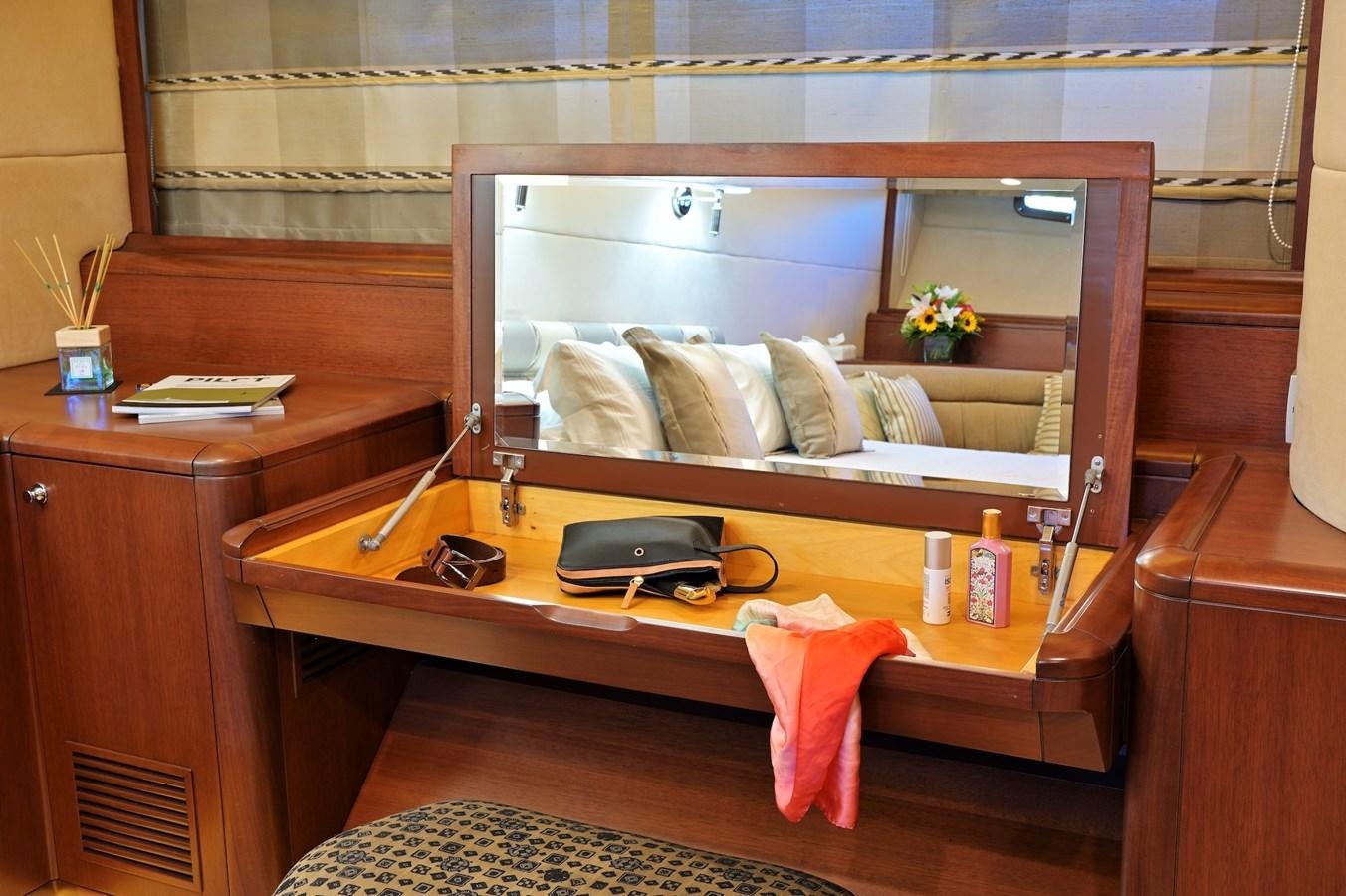 a room with a television and a bed aboard CLARITY Yacht for Sale