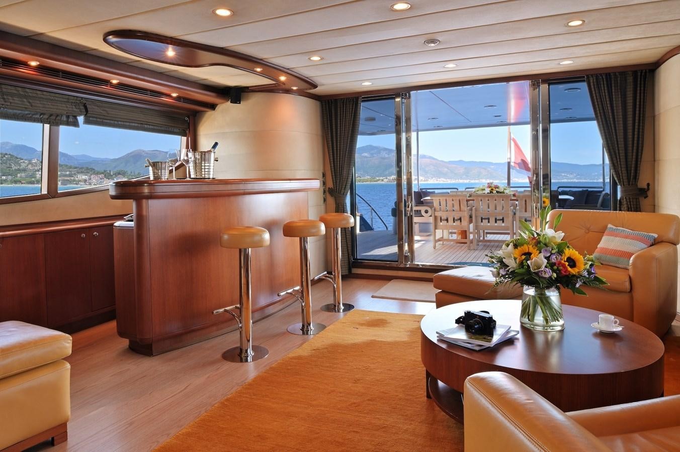 a living room with a large window aboard CLARITY Yacht for Sale