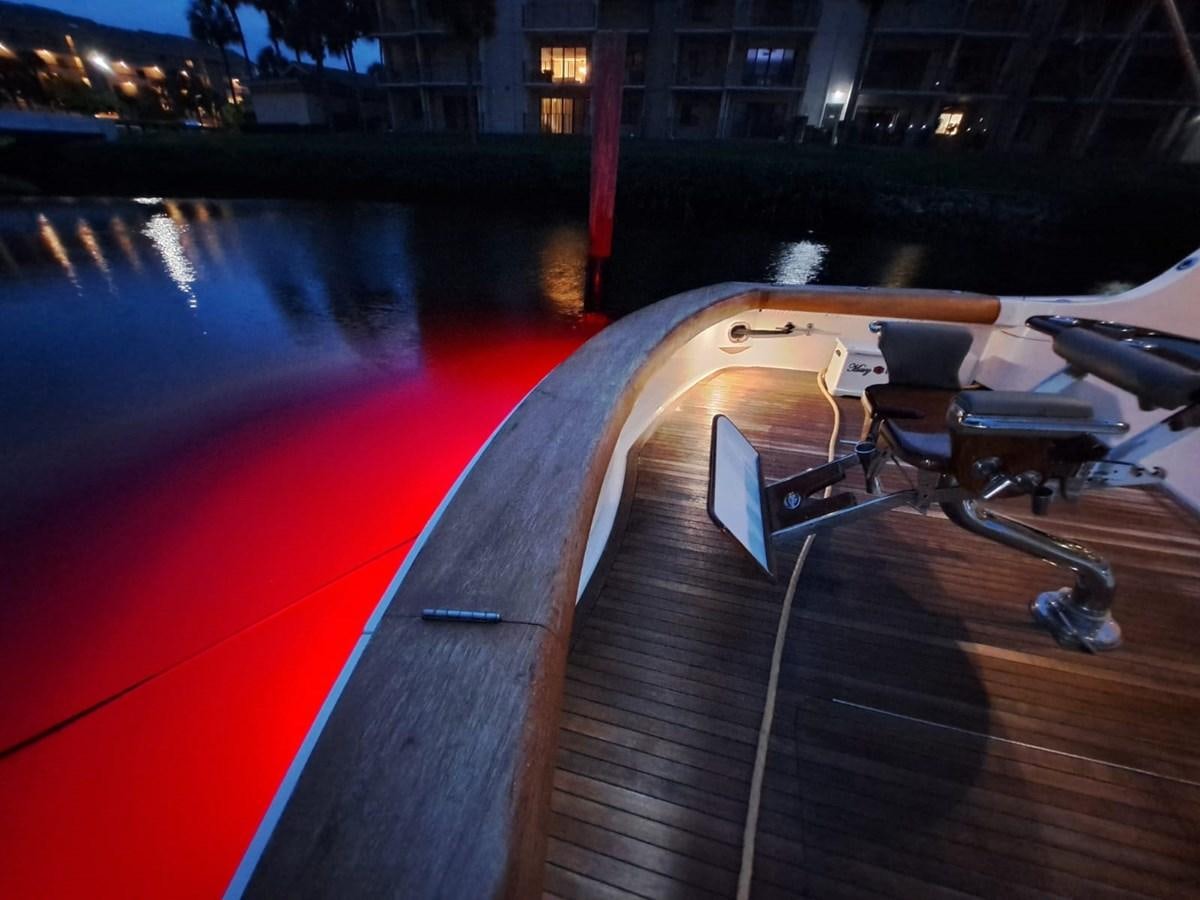 a long wooden deck with a white sign on it aboard MARY ROSE Yacht for Sale