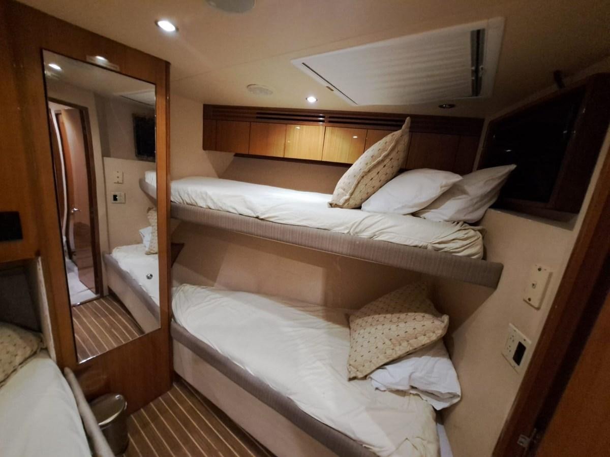 a bed with white sheets aboard MARY ROSE Yacht for Sale