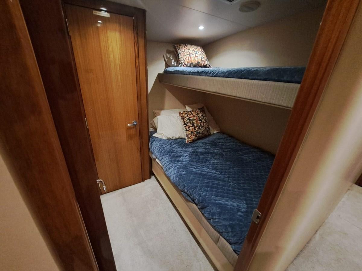 a bedroom with a double bed aboard MARY ROSE Yacht for Sale