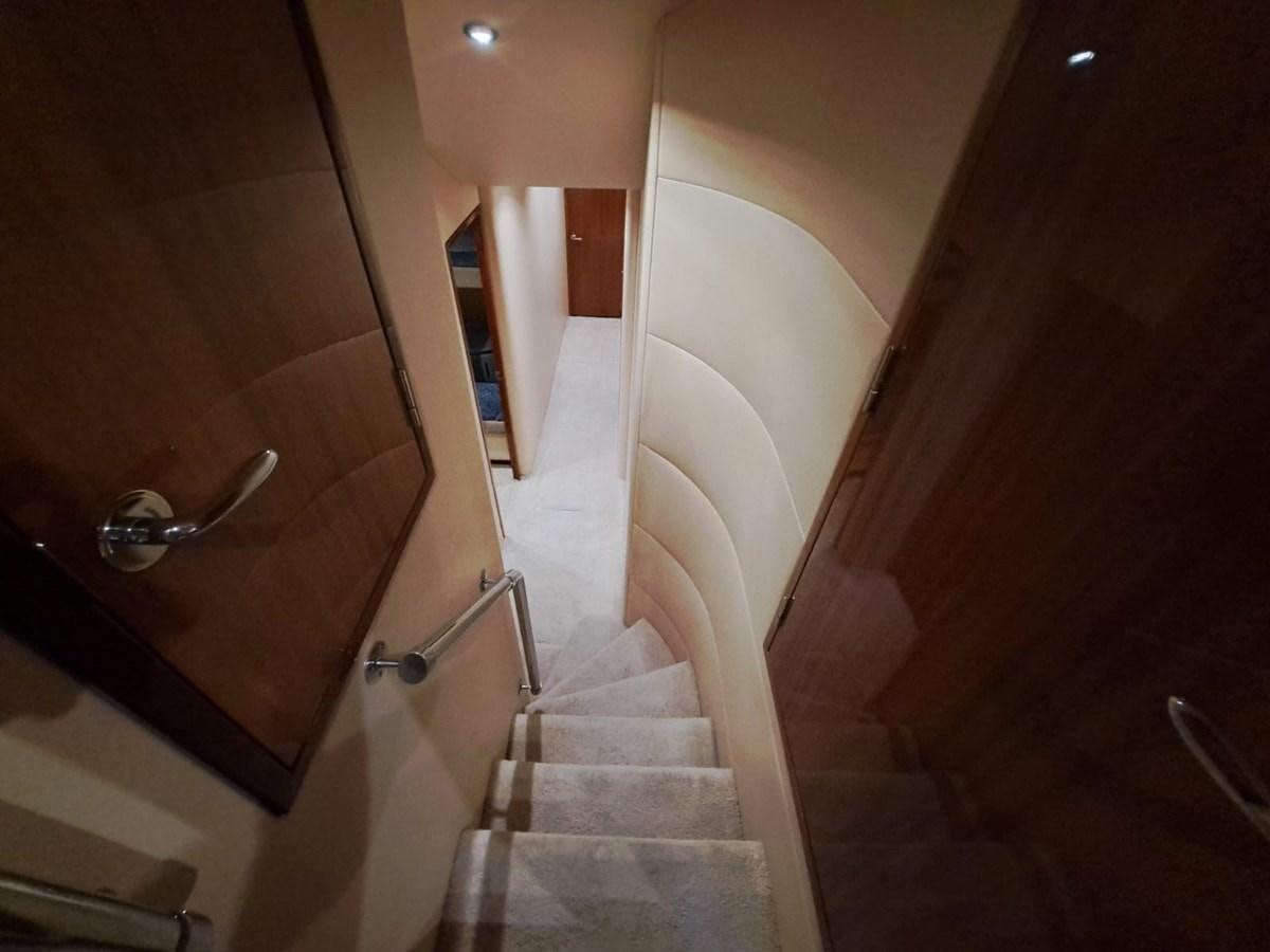 a bathroom with a wood door aboard MARY ROSE Yacht for Sale
