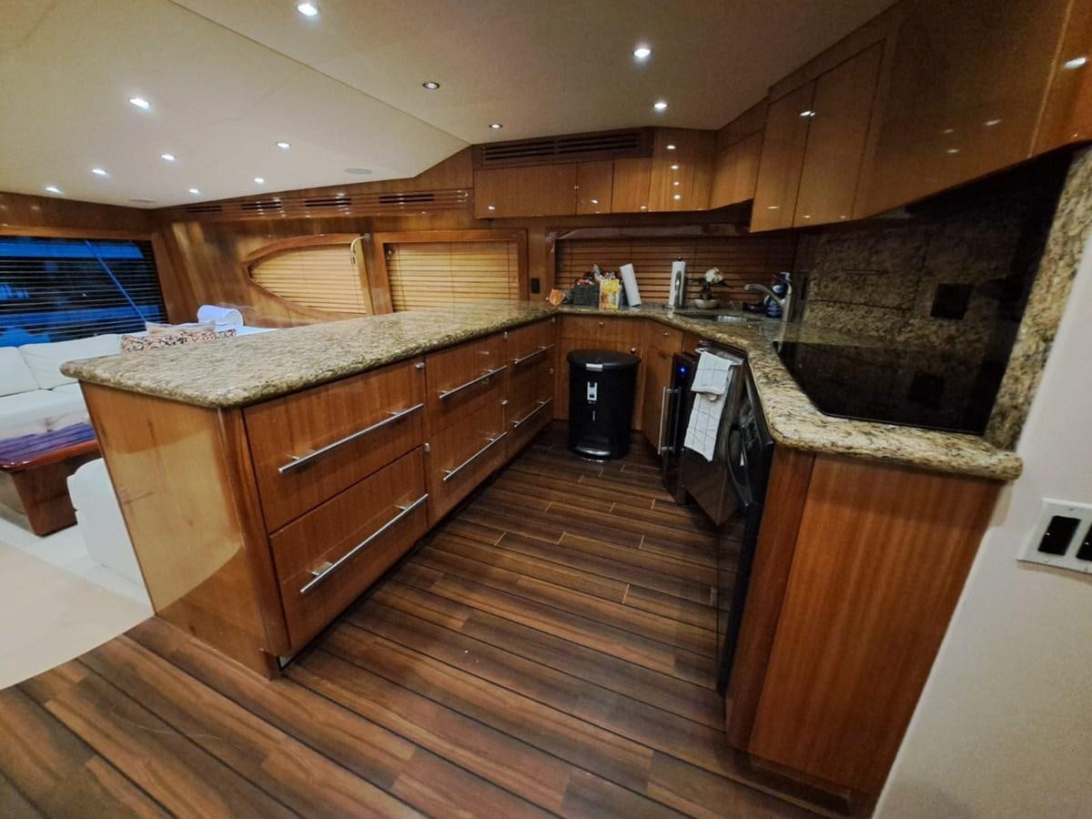a kitchen with wooden cabinets aboard MARY ROSE Yacht for Sale
