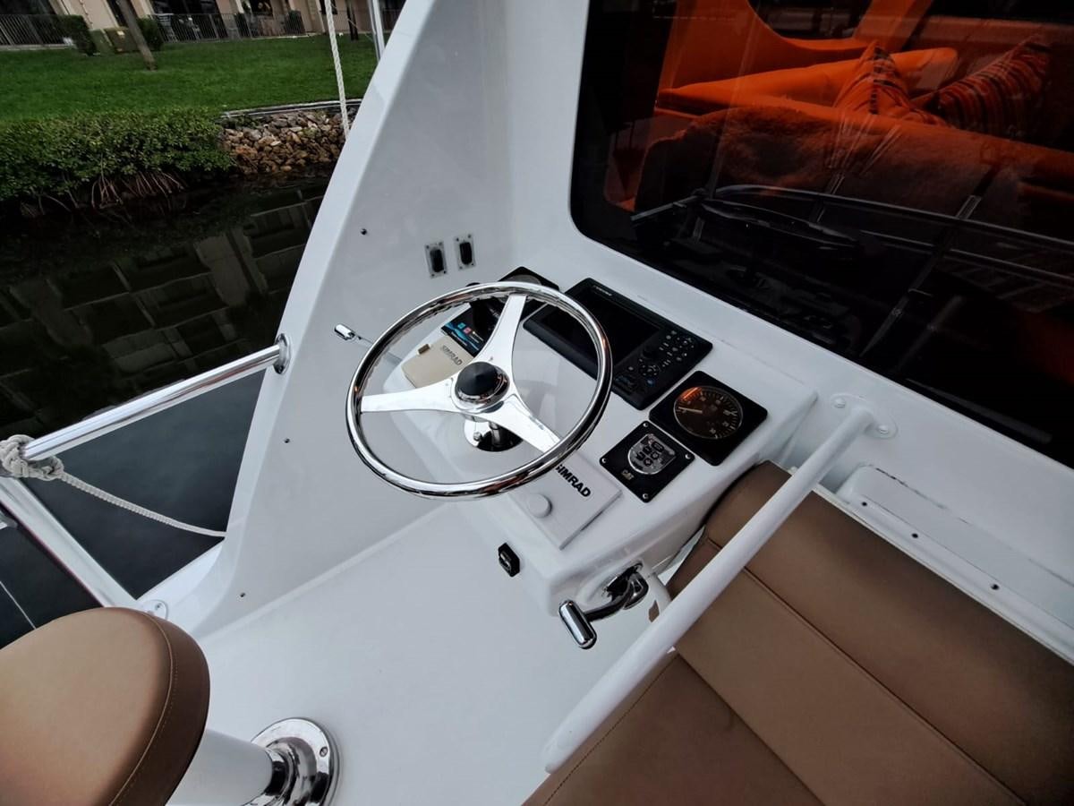 a white car with a broken steering wheel aboard MARY ROSE Yacht for Sale