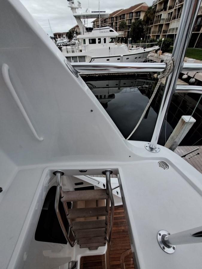a boat with a chair on the deck aboard MARY ROSE Yacht for Sale