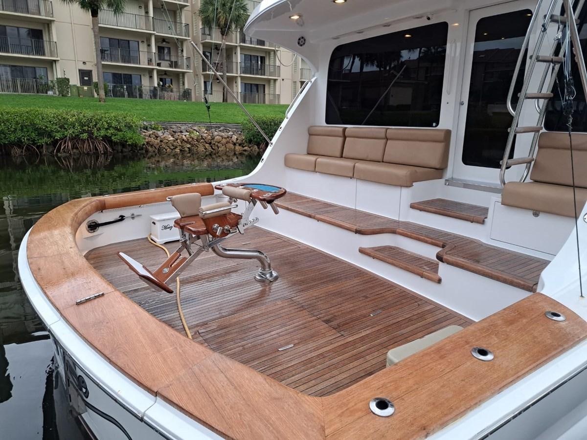 a deck with a table and chairs aboard MARY ROSE Yacht for Sale