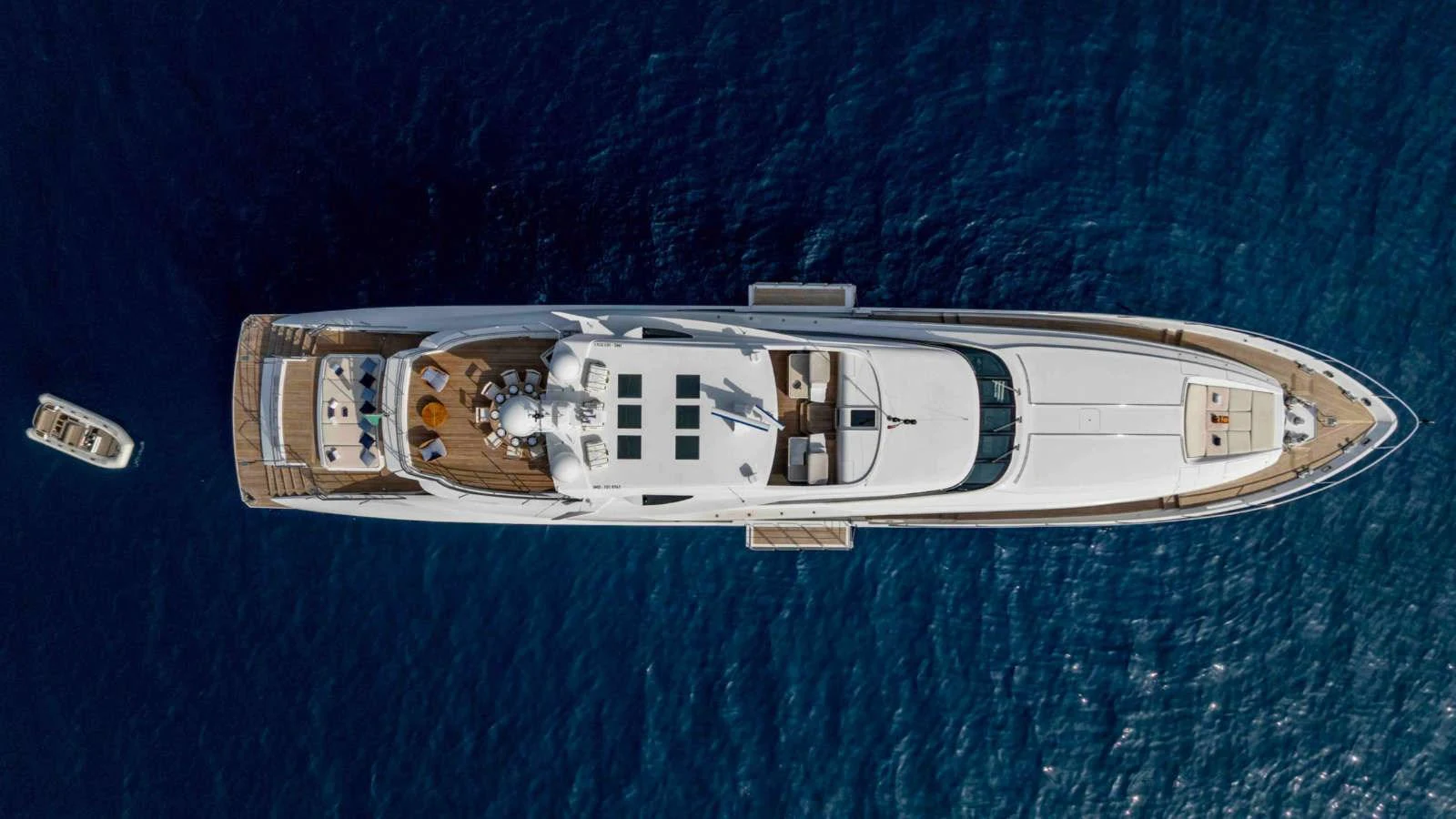 This aerial view showcases the full length of the yacht, highlighting its sleek design and spacious decks. aboard PALMER JOHNSON 150 Yacht for Sale