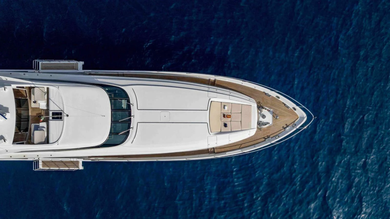 A stunning aerial view of the yacht's sleek and elegant design as it glides over the deep blue sea. aboard PALMER JOHNSON 150 Yacht for Sale