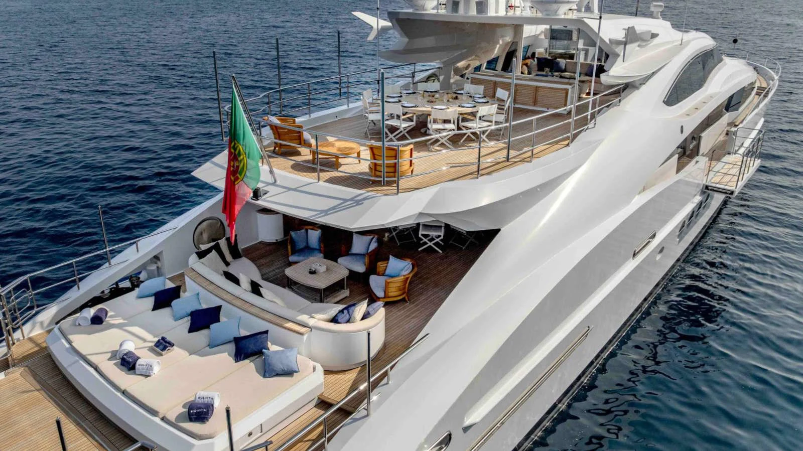 The yacht's aft deck features luxurious lounging areas and elegant dining spaces, perfect for relaxation and entertainment. aboard PALMER JOHNSON 150 Yacht for Sale