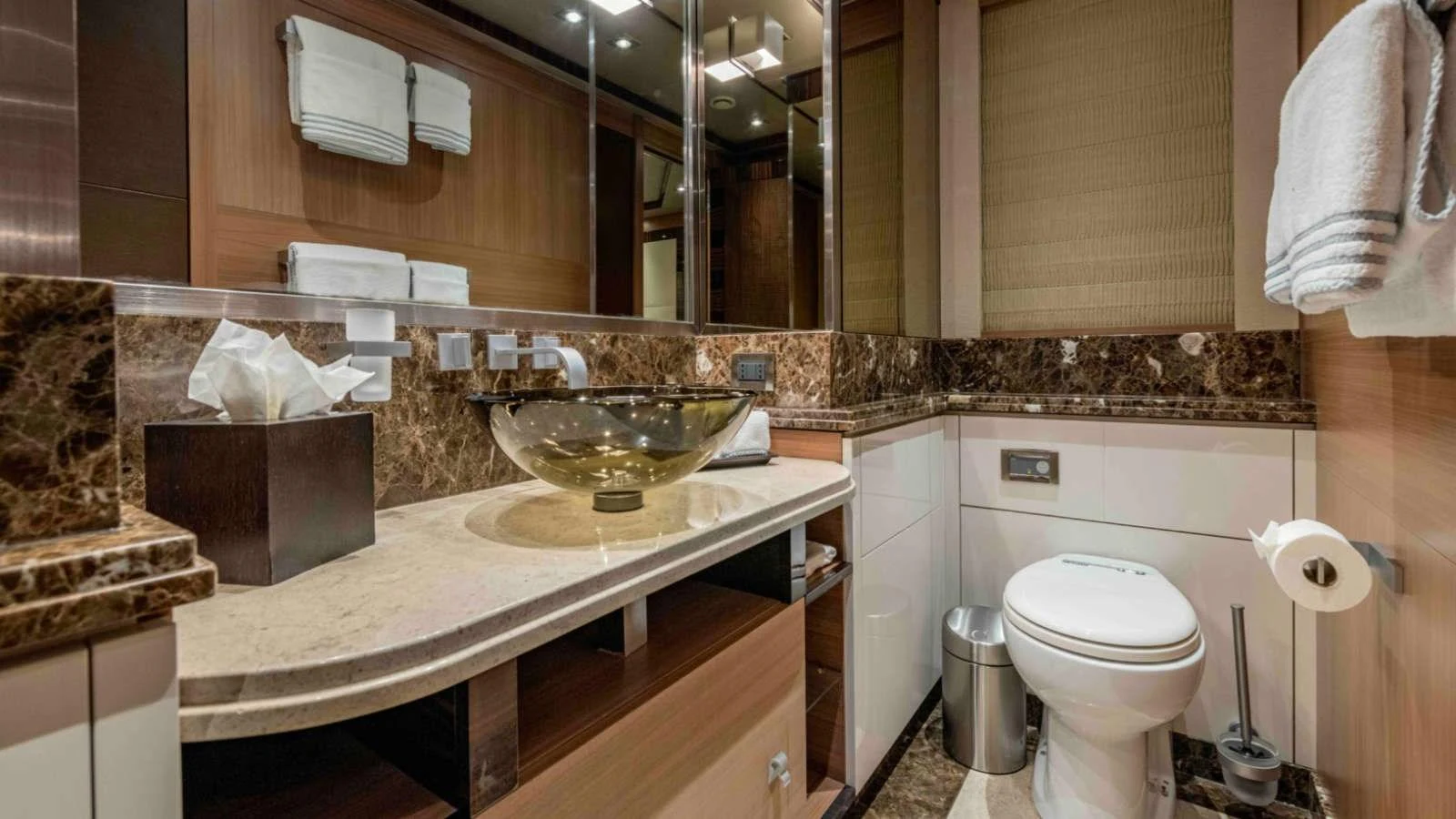 The yacht's bathroom features luxurious marble countertops and modern fixtures. aboard PALMER JOHNSON 150 Yacht for Sale