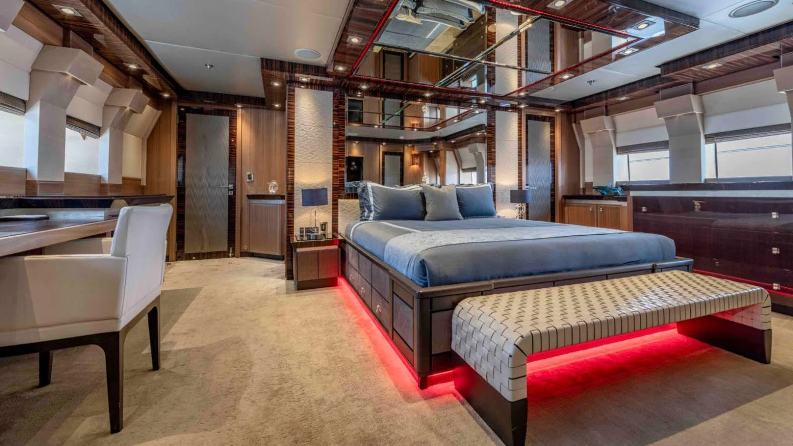 The master stateroom exudes luxury with its spacious layout, elegant furnishings, and ambient lighting. aboard PALMER JOHNSON 150 Yacht for Sale