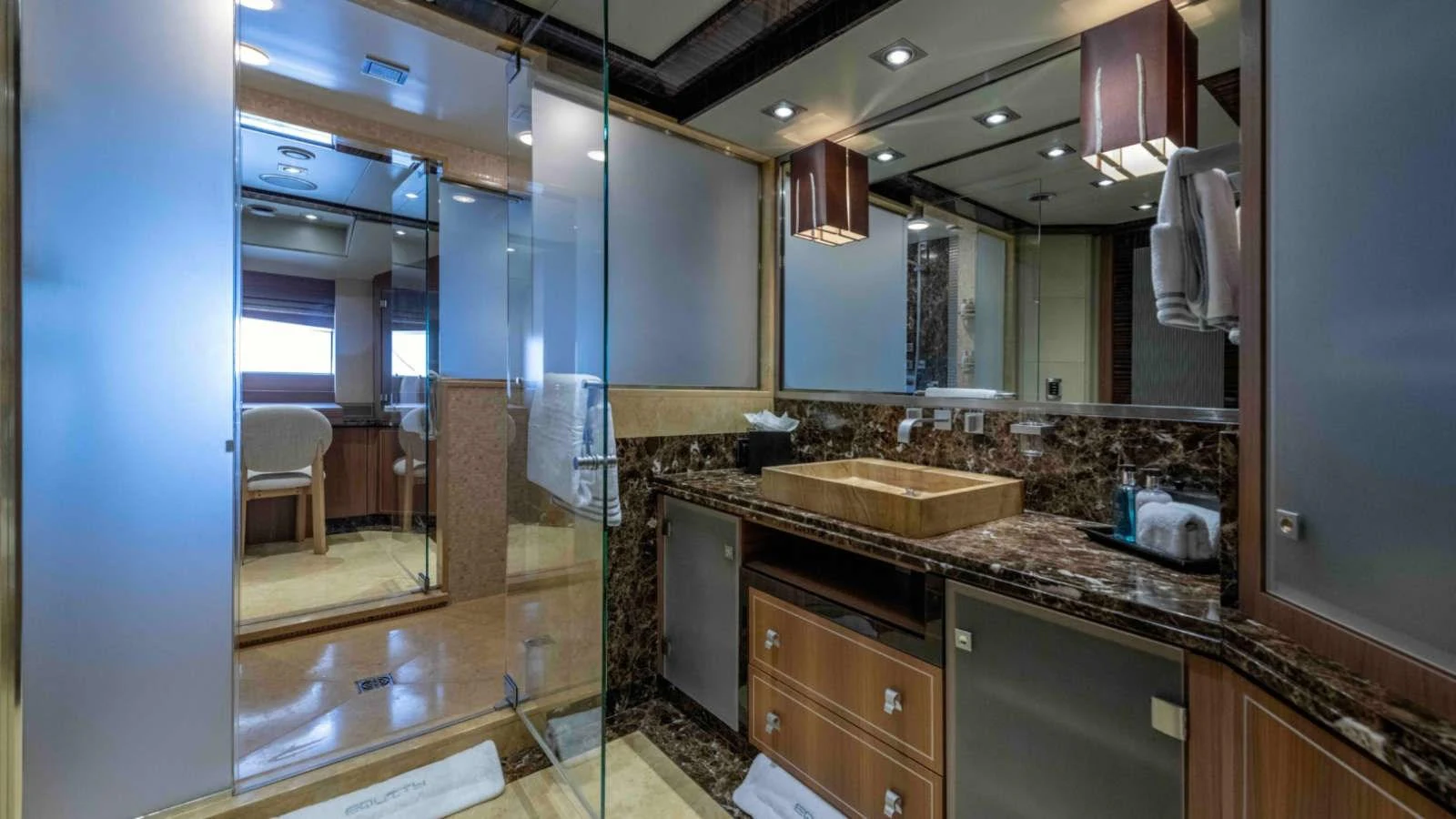 The yacht's bathroom features luxurious finishes and modern amenities. aboard PALMER JOHNSON 150 Yacht for Sale