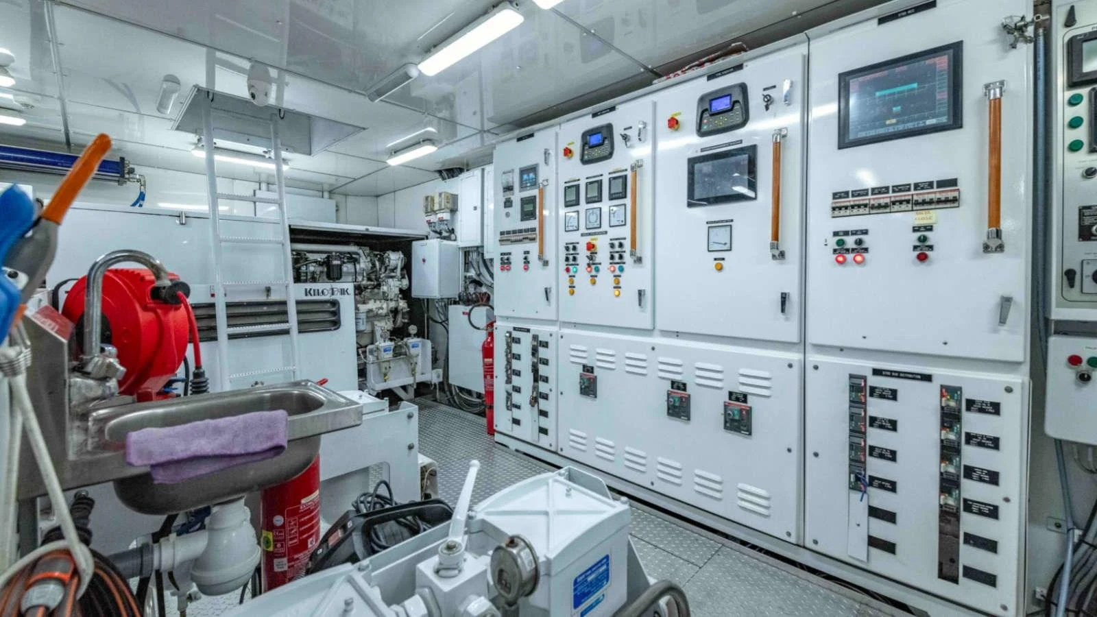 The engine room is equipped with advanced control panels and machinery, ensuring optimal performance and safety. aboard PALMER JOHNSON 150 Yacht for Sale